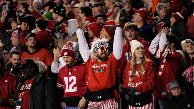Oct 28, 2023; Madison, Wisconsin, USA; Wisconsin Badgers fans celebrate a touchdown during the second half of the NCAA football game against the Ohio State Buckeyes at Camp Randall Stadium. Ohio State won 24-10.